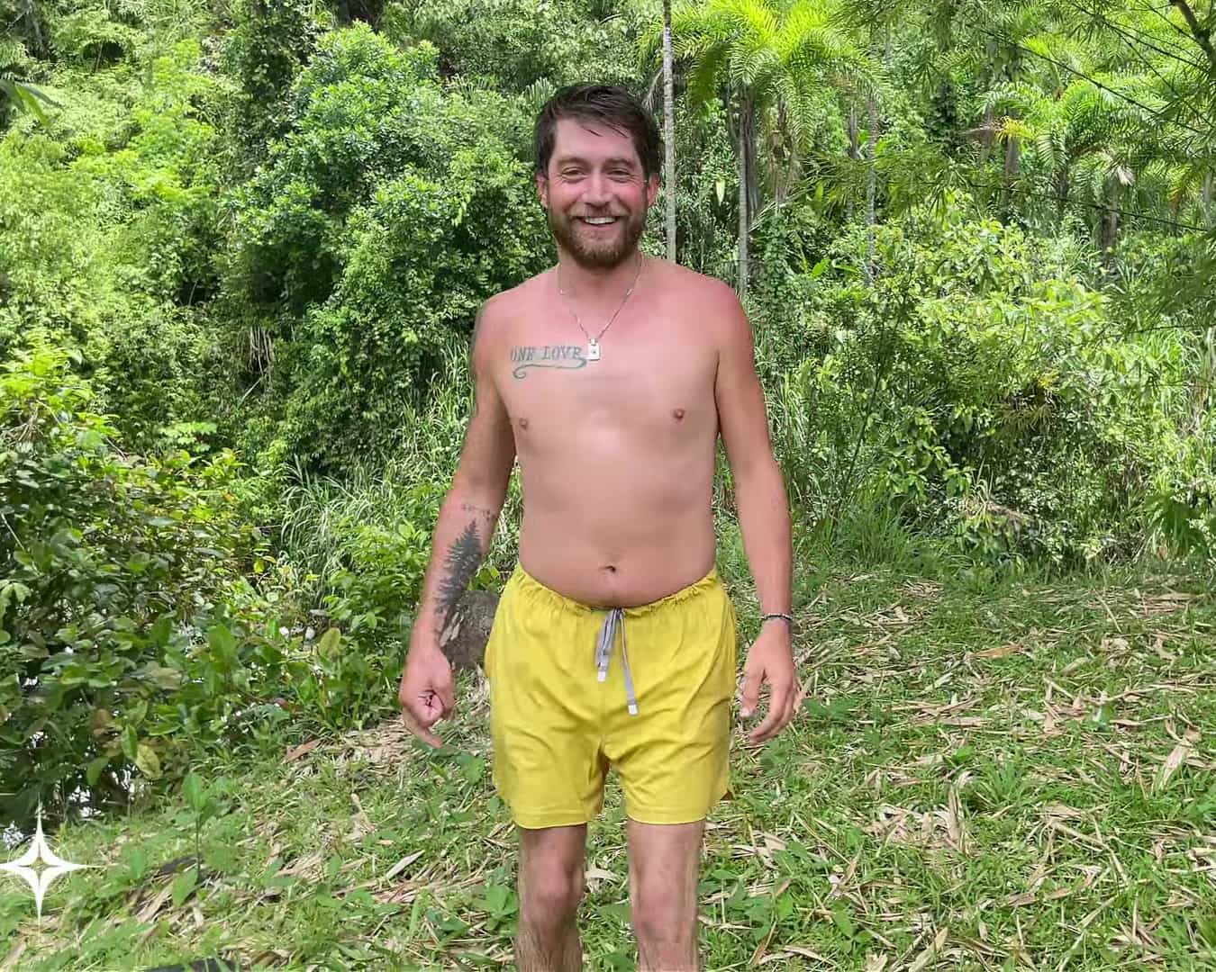 Gregory standing on the riverbank at the homestead