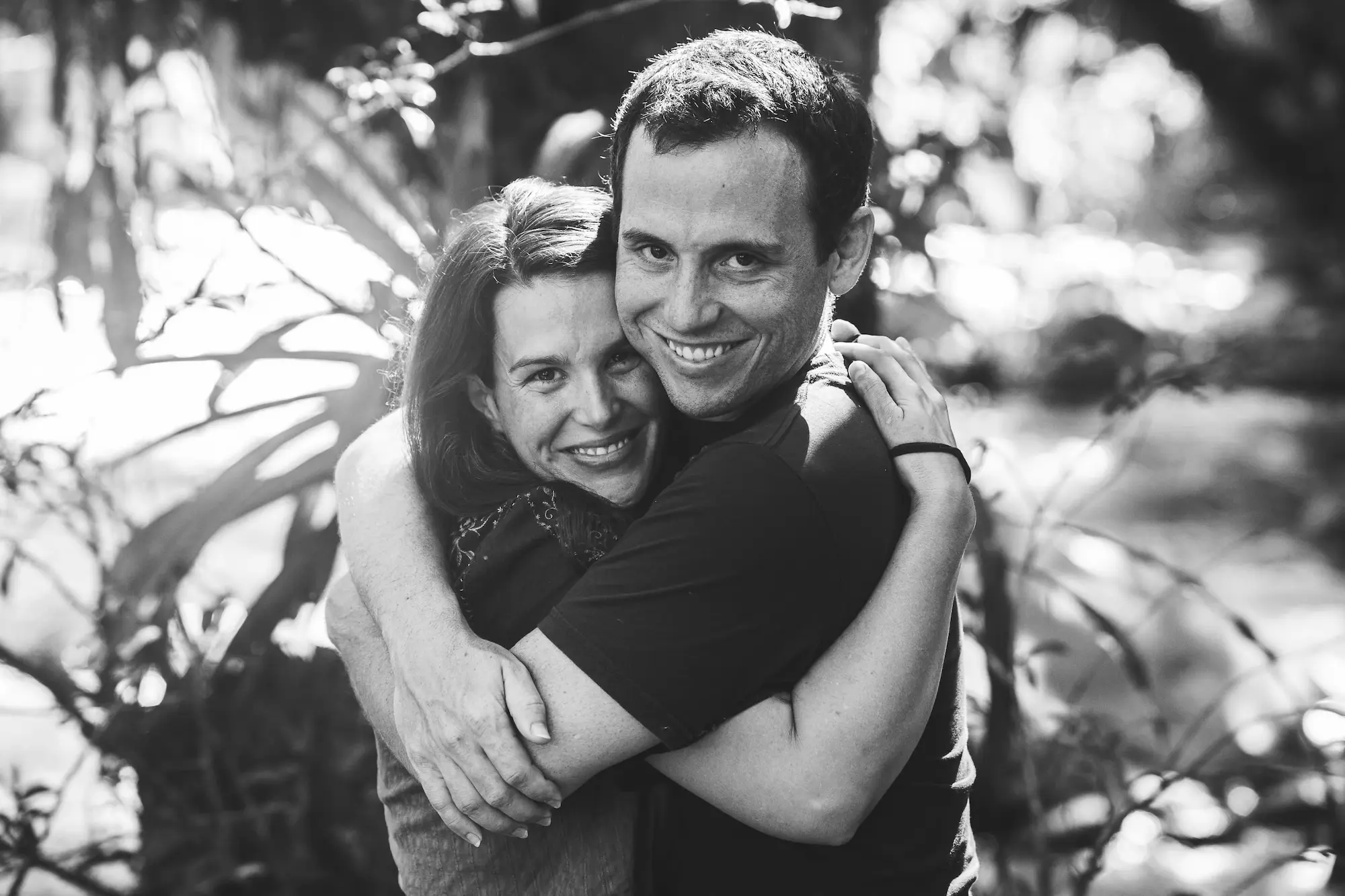 Michael and Yara embracing, photographed in black and white